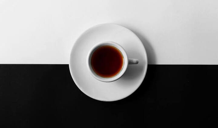 coffee on a black and white platform