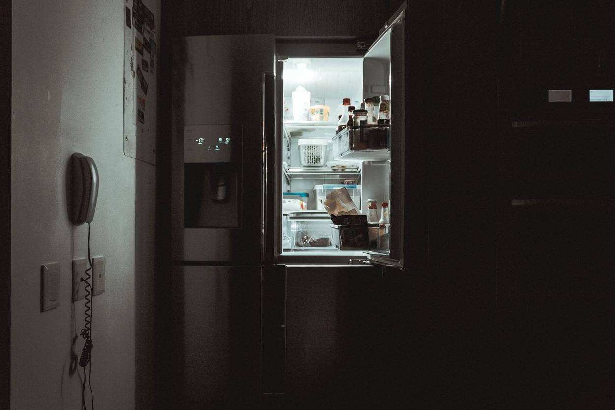 An opened door of a freezer.