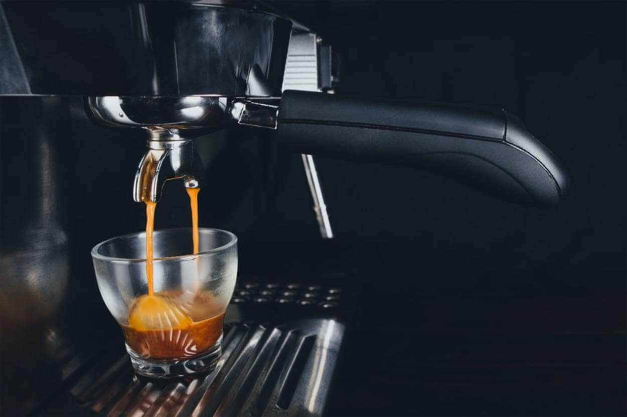 Espresso pouring from espresso machine.