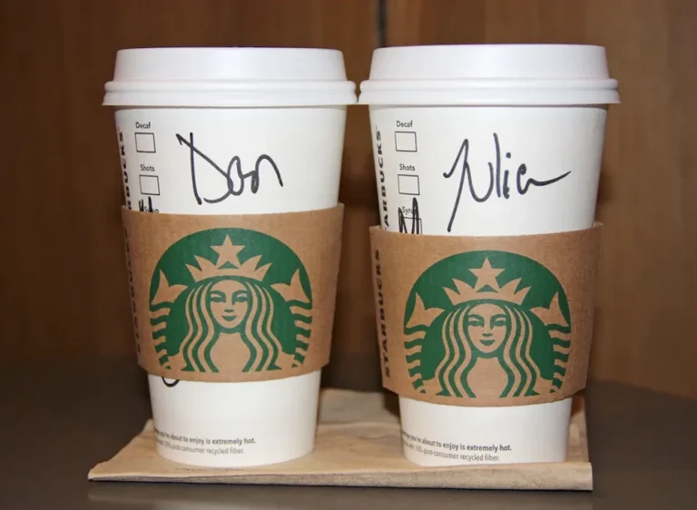 Names written on two Starbucks cups