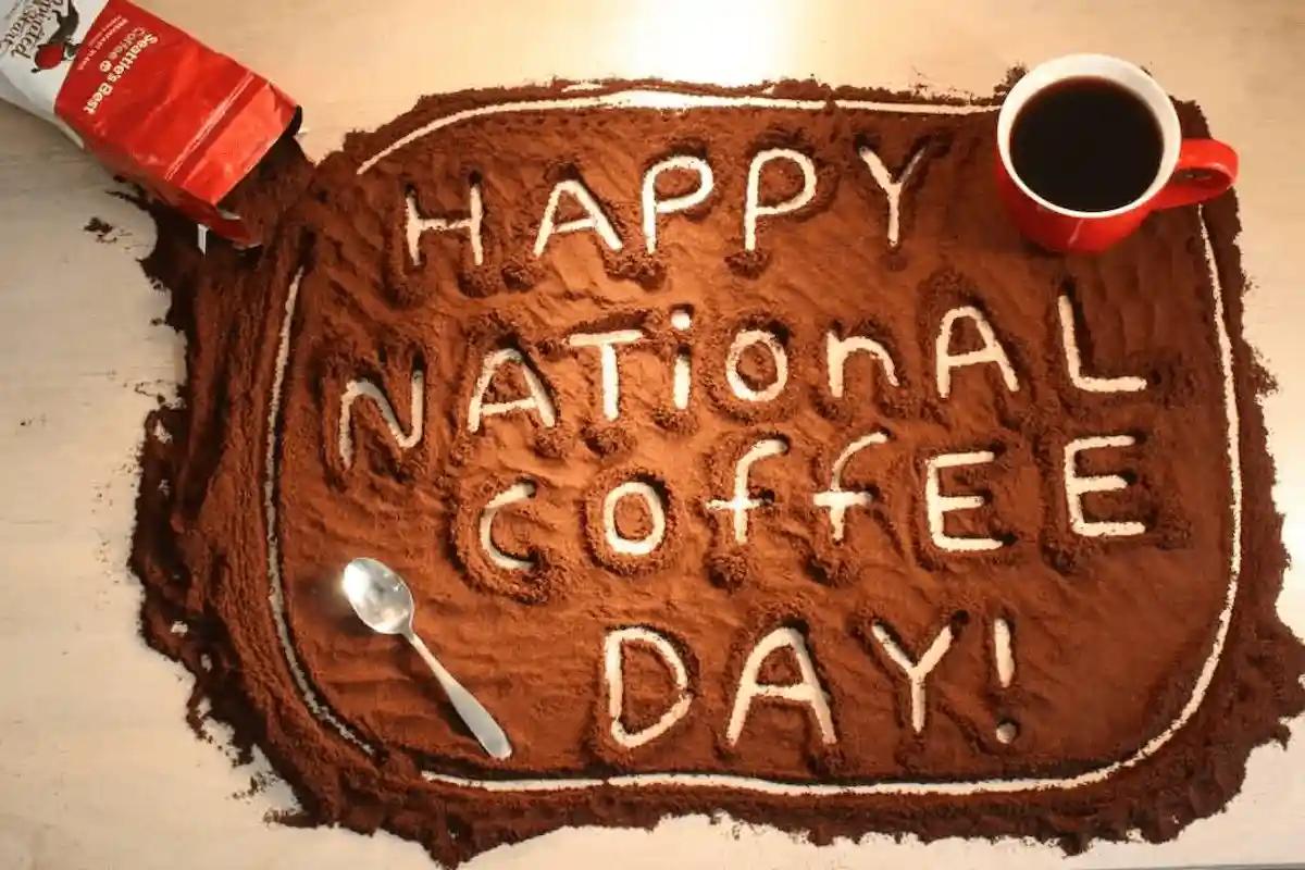 Happy national coffee day sign made from ground coffee